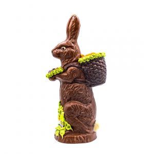 chocolate bunny on it's hind legs with a basket on it's back