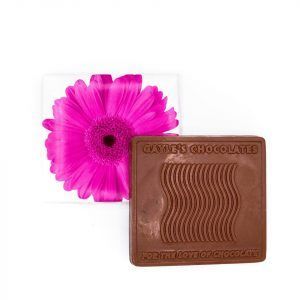 square chocolate bar with a white box with a pink daisy on it